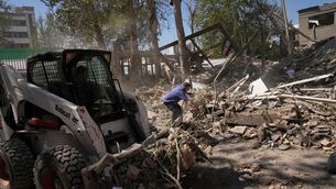 <p>Workers remove debris at Tehran's Sharif University of Technology complex that Iranian authorities say was hit by a US-Israeli strike on Monday. Picture: Francisco Seco/AP</p> <p>Workers remove debris at Tehran's Sharif University of Technology complex that Iranian authorities say was hit by a US-Israeli strike on Monday. Picture: Francisco Seco/AP</p>