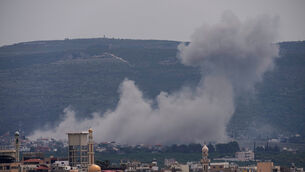 Smoke rises following an Israeli air strike on a village in Lebanon (Hussein Malla/AP) Smoke rises following an Israeli air strike on a village in Lebanon (Hussein Malla/AP)