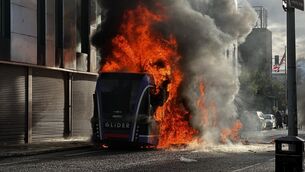 <p>A Glider bus, set fire by protesters, on the Newtownards Road in east Belfast. Picture: PA Wire</p> <p>A Glider bus, set fire by protesters, on the Newtownards Road in east Belfast. Picture: PA Wire</p>