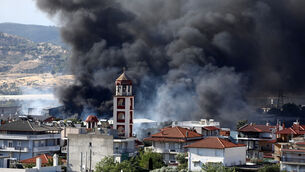 <p>Thick smoke rises above the village of Filothei during a wildfire on the outskirts of the northern city of Thessaloniki, Greece (Giannis Papanikos/AP)</p> <p>Thick smoke rises above the village of Filothei during a wildfire on the outskirts of the northern city of Thessaloniki, Greece (Giannis Papanikos/AP)</p>