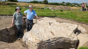<p>University of Galway's Michelle Comber and Noel McCarthy, co-directors of the Maree Project, next to the newly uncovered megalithic capstone of the portal tomb at Maree in Co Galway. Picture: Andrew Downes/Xposure/University of Galway/PA Wire</p> <p>University of Galway's Michelle Comber and Noel McCarthy, co-directors of the Maree Project, next to the newly uncovered megalithic capstone of the portal tomb at Maree in Co Galway. Picture: Andrew Downes/Xposure/University of Galway/PA Wire</p>