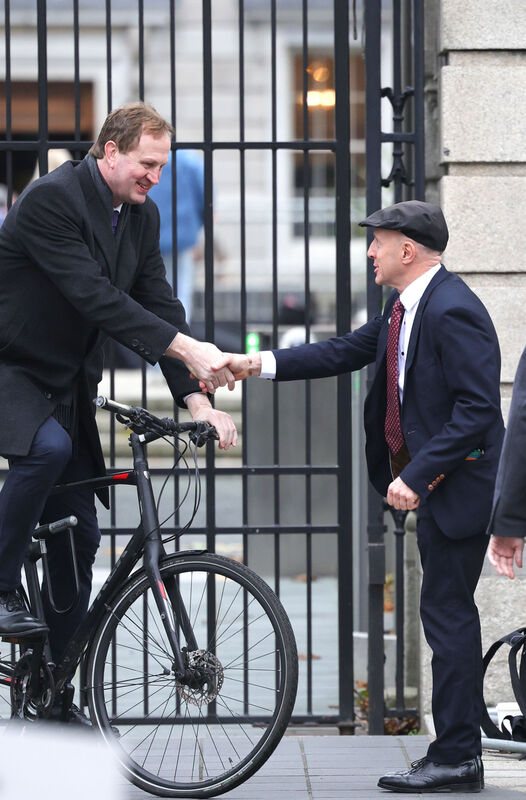 music Michael Healy-Rae greets a cycling Jim O'Callaghan outside Leinster House. Picture: Leah Farrell music Michael Healy-Rae greets a cycling Jim O'Callaghan outside Leinster House. Picture: Leah Farrell
