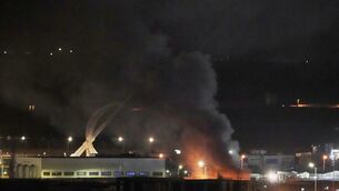 Smoke rises after an explosion at the airport in Irbil, Iraq, late Wednesday, March 11, 2026 (Leo Correa/AP)
