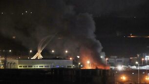 <p>Smoke rises after an explosion at the airport in Irbil, Iraq, late on Wednesday, March. Picture: AP Photo/Leo Correa.</p>