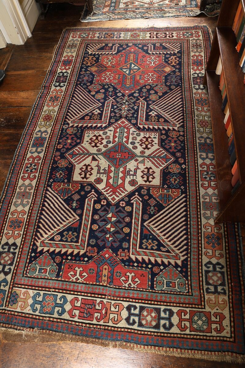 A large antique Caucasian rug at Sheppards.