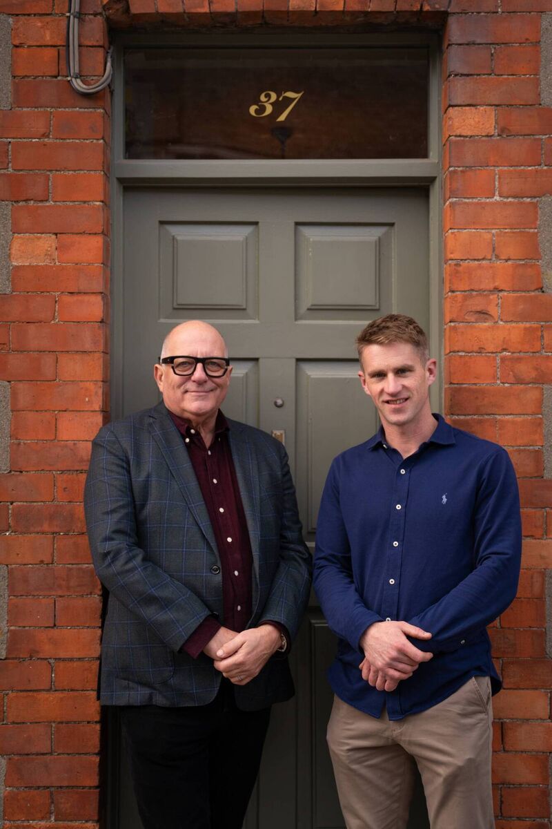 Hugh Wallace and homeowner Sean Hickey.