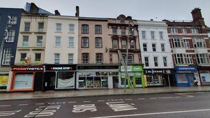 <p>A range of phone and vape shops on Patrick St. Picture: Frank O’Connor/DerelictIreland </p>