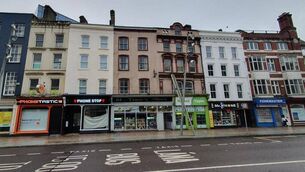 <p>A range of phone and vape shops on Patrick St. Picture: Frank O’Connor/DerelictIreland </p>