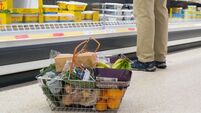 Shoppers at supermarket Sainsbury's for their weekly shopping when special prices are on offer, dealing with the cost of living