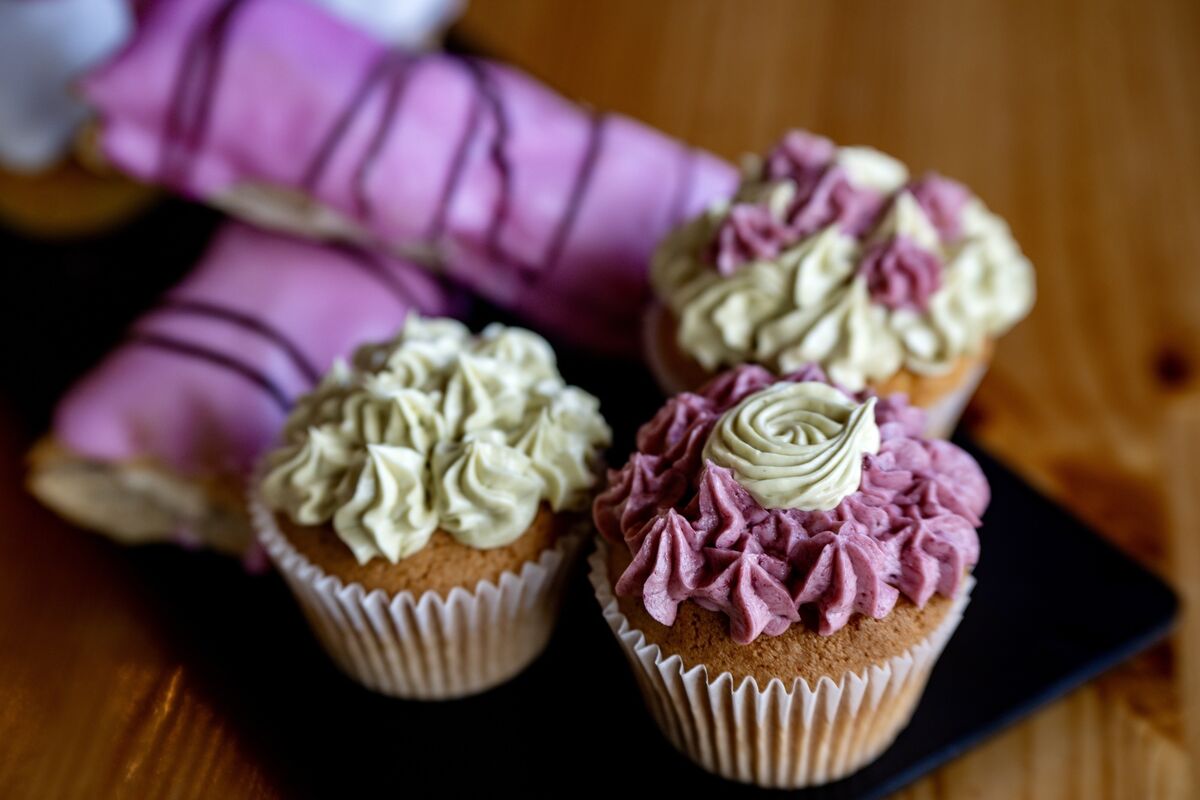 A selection of cupcakes and iced delicacies prepared in the bakery.
