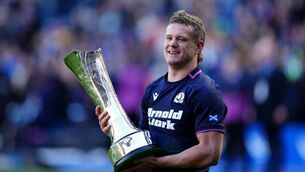<p>SILVER LINING: Scotland's Darcy Graham with the The Auld Alliance Trophy. Pic: Andrew Milligan/PA</p>