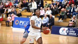 <p>EYES ON PRIZE: Belfast Star's Shane Bell goes for the lay up. Pic: Larry Cummins</p>