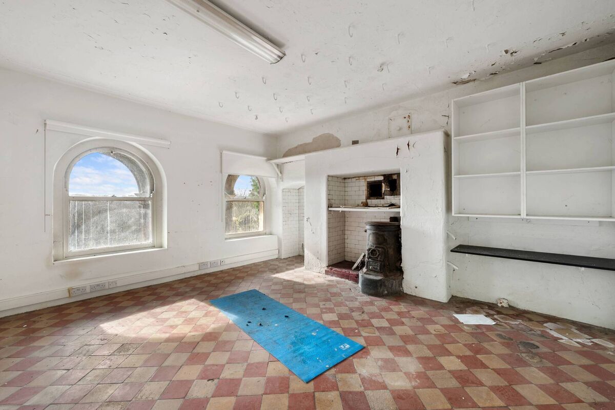 Meat hooks in the ceiling of a basement kitchen