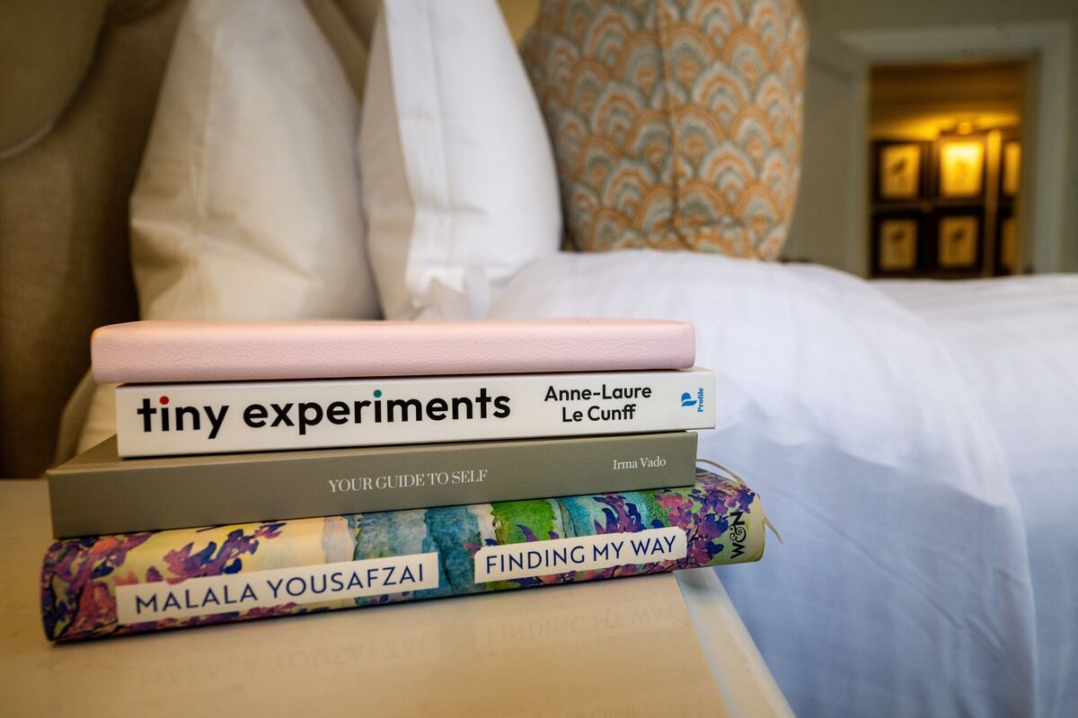 A pile of books and a journal used by Irish Examiner reporter Breda Graham while exploring relaxing bedtime routines in the Shandon Suite at Hayfield Manor. Picture Chani Anderson