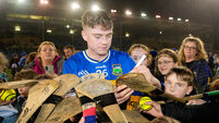 Darragh Stakelum signs autographs on hurls for young fans after the game 21/2/2026