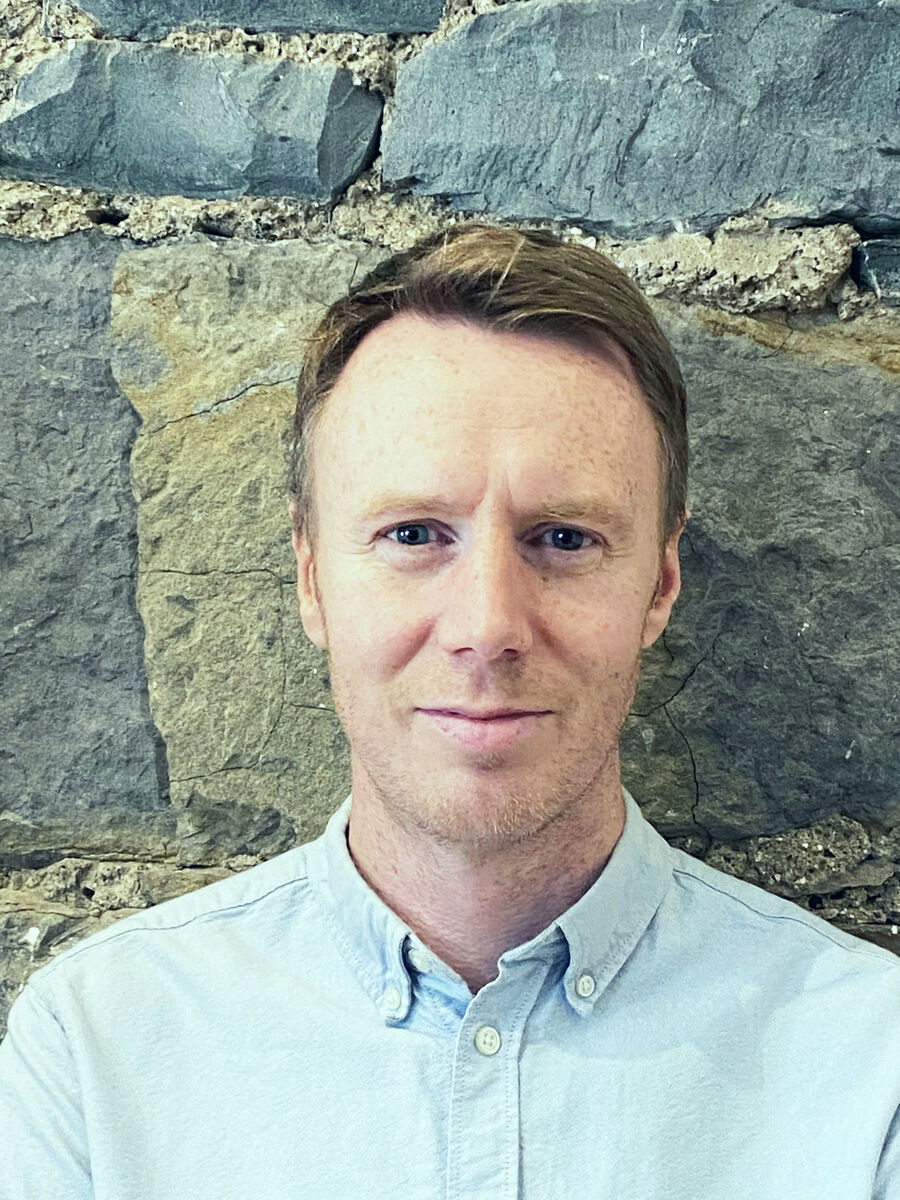 John Walsh, who wears headphones at work, believes the solution lies in better design of office space.