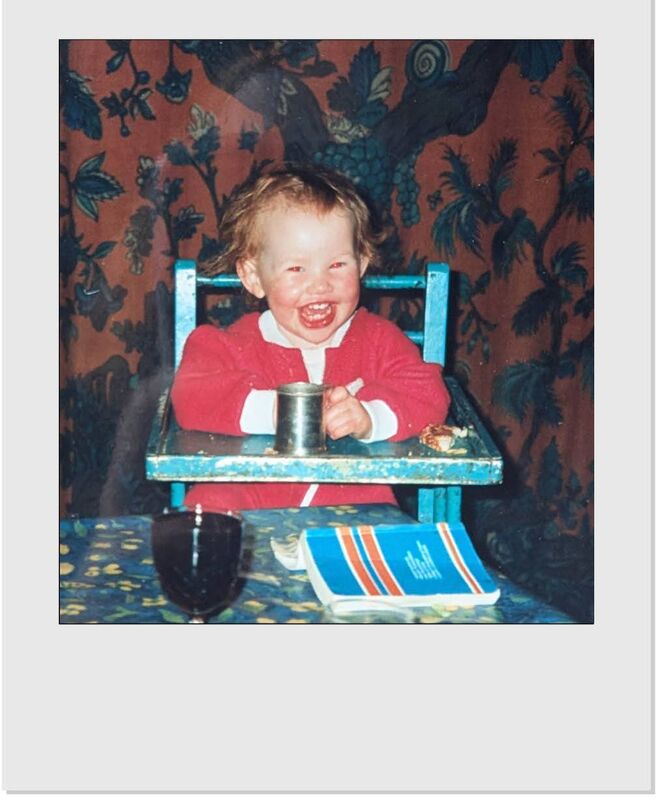 Megan, as a baby in Inis Mór, a foclóir on the table in front of her Megan, as a baby in Inis Mór, a foclóir on the table in front of her