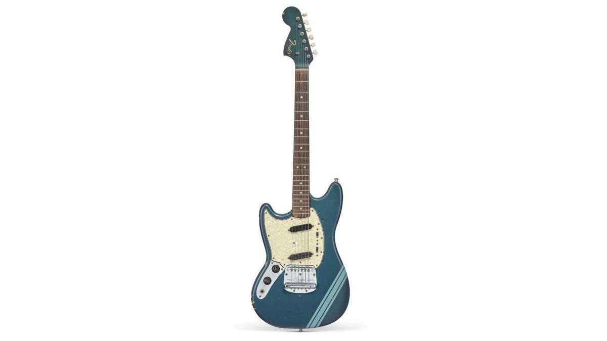 Nirvana frontman Kurt Cobain's Fender Mustang guitar used in the music video for 'Smells... Like Teen Spirit' sold for $6,907,000. Picture: Christie's/PA 