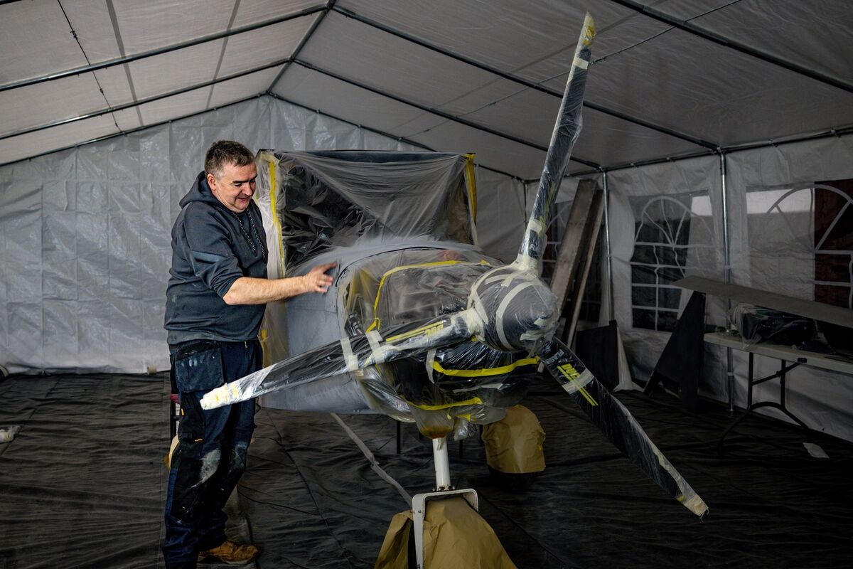 Mark Brereton, accounts manager at the FunFly Aerosports flying club in Offaly, painting, sanding, and assembling a Savannah kit plane. Picture: Chani Anderson
