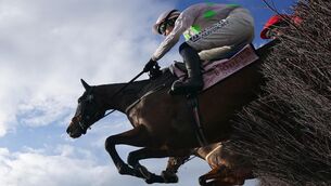 <p>TOWERING: Gaelic Warrior ridden by Paul Townend on their way to winning the Gold Cup Chase on day four. Pic: Bradley Collyer/PA</p>