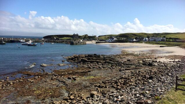 <p>Clare Island Harbour, with Clare Island Castle, the 16th century Grace O’Malley stronghold, visible in the background above the harbour walls.</p>