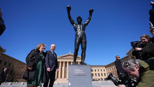 <p>Taoiseach Micheál Martin and his wife Mary Martin pose next to the statue of Rocky Balboa in Philadelphia. Picture: Niall Carson/PA Wire</p>