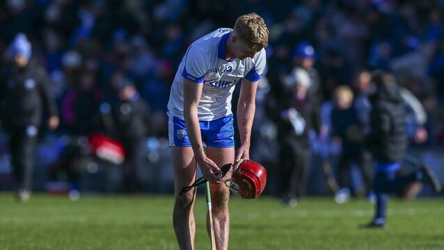<p>DOWN AND OUT: Waterford’s Peter Hogan dejected at the end of the game. Pic: ©INPHO.</p>