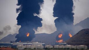 <p>Plumes of smoke and fire rise after debris from an intercepted Iranian drone struck an oil facility, according to authorities, in Fujairah, United Arab Emirates (Altaf Qadri/AP)</p> <p>Plumes of smoke and fire rise after debris from an intercepted Iranian drone struck an oil facility, according to authorities, in Fujairah, United Arab Emirates (Altaf Qadri/AP)</p>