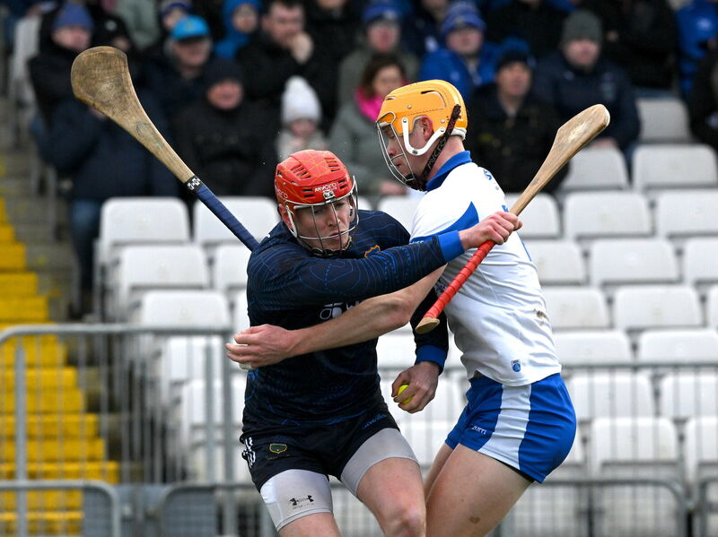 Rhys Shelly of Tipperary is tackled by Seán Walsh of Waterford. Pic; Ray McManus/Sportsfile