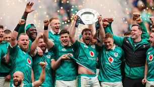 <p>LOOKING FORWARD: Ireland’s Caelan Doris lifts the Triple Crown Trophy. Pic: ©INPHO/Ryan Byrne.</p>