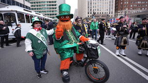 <p class="contextmenu internal_Caption">People during the St Patrick’s Day Parade in Philadelphia. Picture: Niall Carson/PA</p>