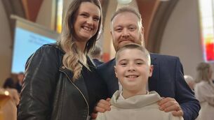 <p>Caren and Robert Flanagan with their son Luke at his Confirmation. The Irish Cancer Society's transport service gave Robert lifts to hospital after he was diagnosed with colorectal cancer. Picture: Irish Cancer Society</p>