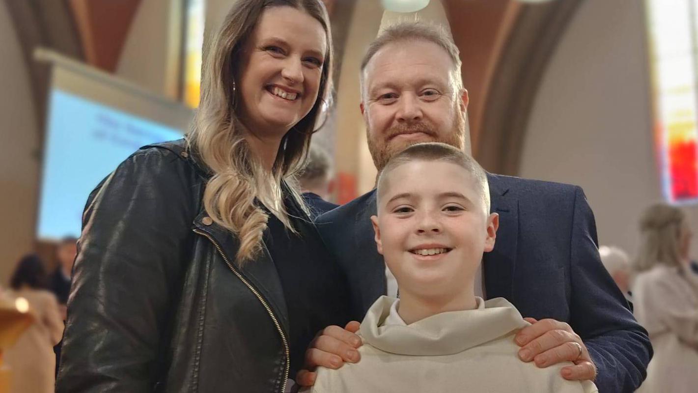 Caren and Robert Flanagan with their son Luke at his Confirmation. The Irish Cancer Society's transport service gave Robert lifts to hospital after he was diagnosed with colorectal cancer. Picture: Irish Cancer Society