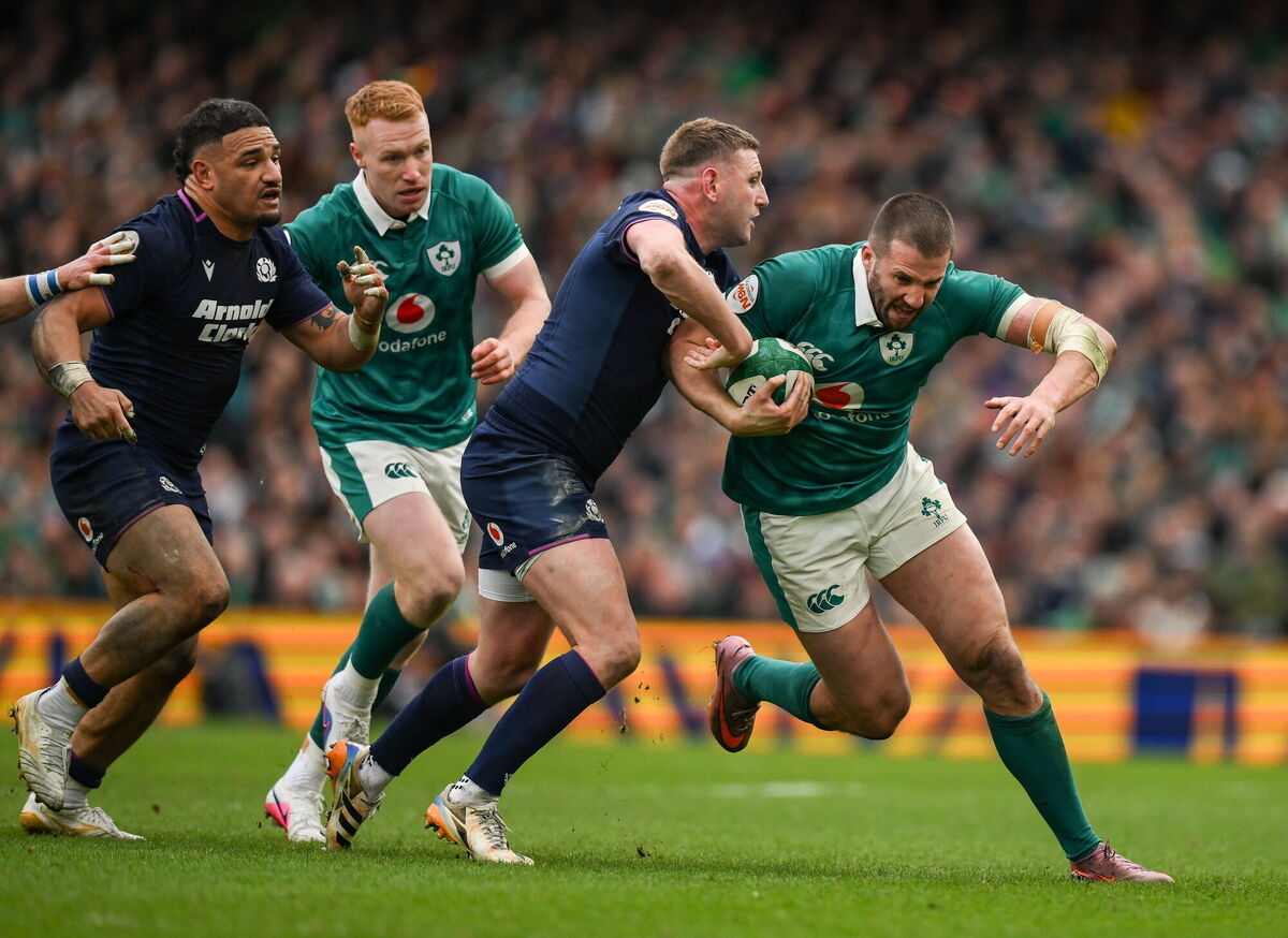 Stuart McCloskey is tackled by Finn Russell. Pic: Brendan Moran/Sportsfile.