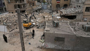 <p>Destroyed buildings of a police station and nearby houses are seen after Friday's U.S.-Israeli strike in Tehran, Iran, Sunday, March 15, 2026. (AP Photo/Vahid Salemi)</p>