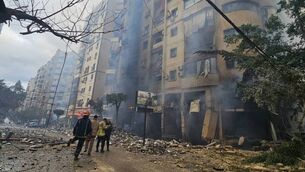 <p>Rescuers arrive at the site of an Israeli airstrike on a residential block in Beirut's southern suburb Haret Hreik on March 15. Picture: AFP via Getty Images.</p>