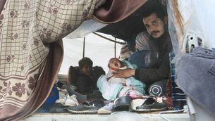 <p>A displaced family sits in the back of a pickup truck, their current home, covered in plastic sheeting for protection from stormy weather along the seafront corniche, in the southern city of Sidon. Picture: Mahmoud ZAYYAT / AFP via Getty Images.</p> <p>A displaced family sits in the back of a pickup truck, their current home, covered in plastic sheeting for protection from stormy weather along the seafront corniche, in the southern city of Sidon. Picture: Mahmoud ZAYYAT / AFP via Getty Images.</p>