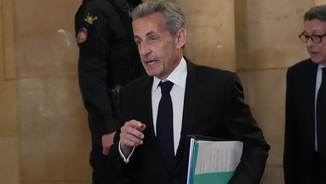 Former French president Nicolas Sarkozy arrives at the appeals courthouse (Thibault Camus/AP)