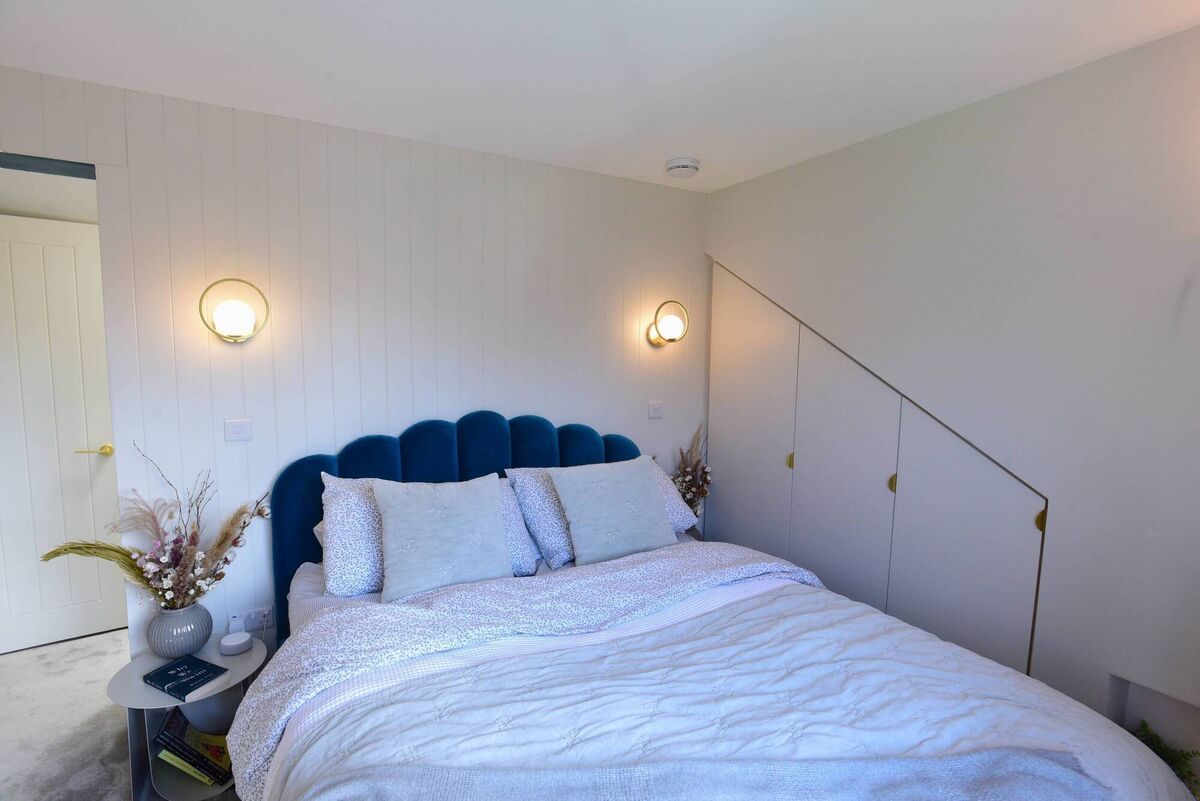 Ottoman beds that lift on hinges provide storage for bulky items. 