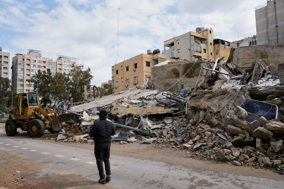 A bulldozer clears debris from the rubble of buildings destroyed in an Israeli airstrike, in Dahiyeh, Beirut's southern suburbs, Lebanon. Picture: AP Photo/Bilal Hussein