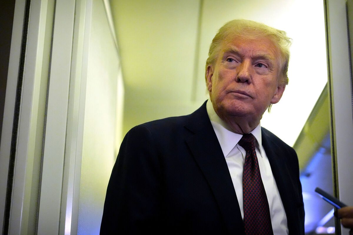 US President Donald Trump speaks to reporters aboard Air Force One om Sunday, March 15. Picture: AP Photo/Mark Schiefelbein