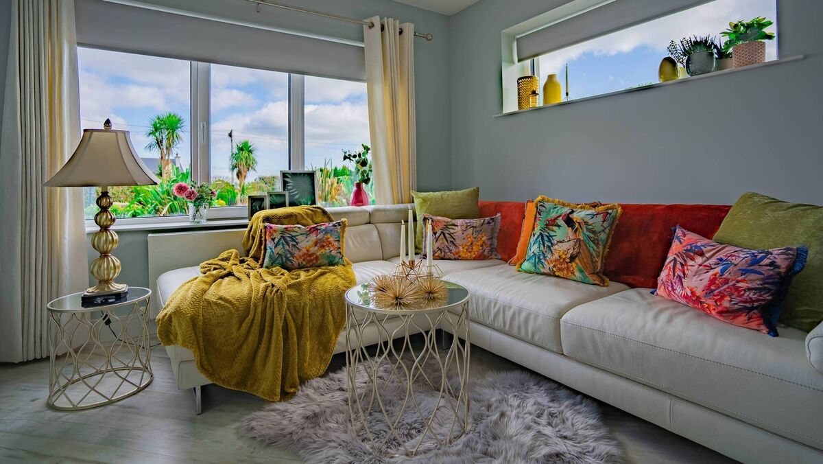 A sofa is among the 'smart spends' when we move into a new home, according to interior designer Maura Mackey (interior design by Maura pictured). 