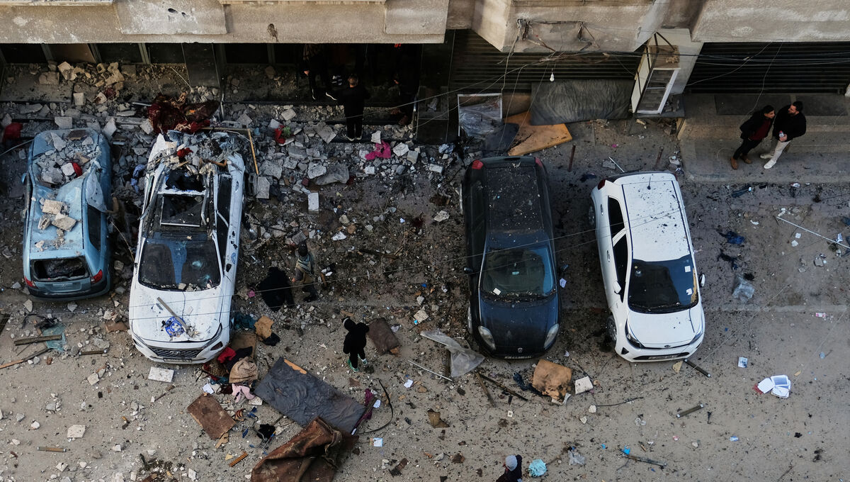 Palestinians survey the damage to an apartment building after an Israeli military strike killed several people in Gaza City in January. Picture: Jehad Alshrafi/AP