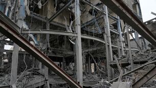 The shattered structure of a police station is seen after it was hit Friday in a US-Israeli strike in Tehran (Vahid Salemi/AP)