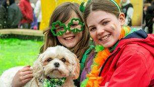 <p>Sophie and Grace Harris from Cork with their dog 'Lola' at last year's parade in Bantry. Picture: Andy Gibson.</p>