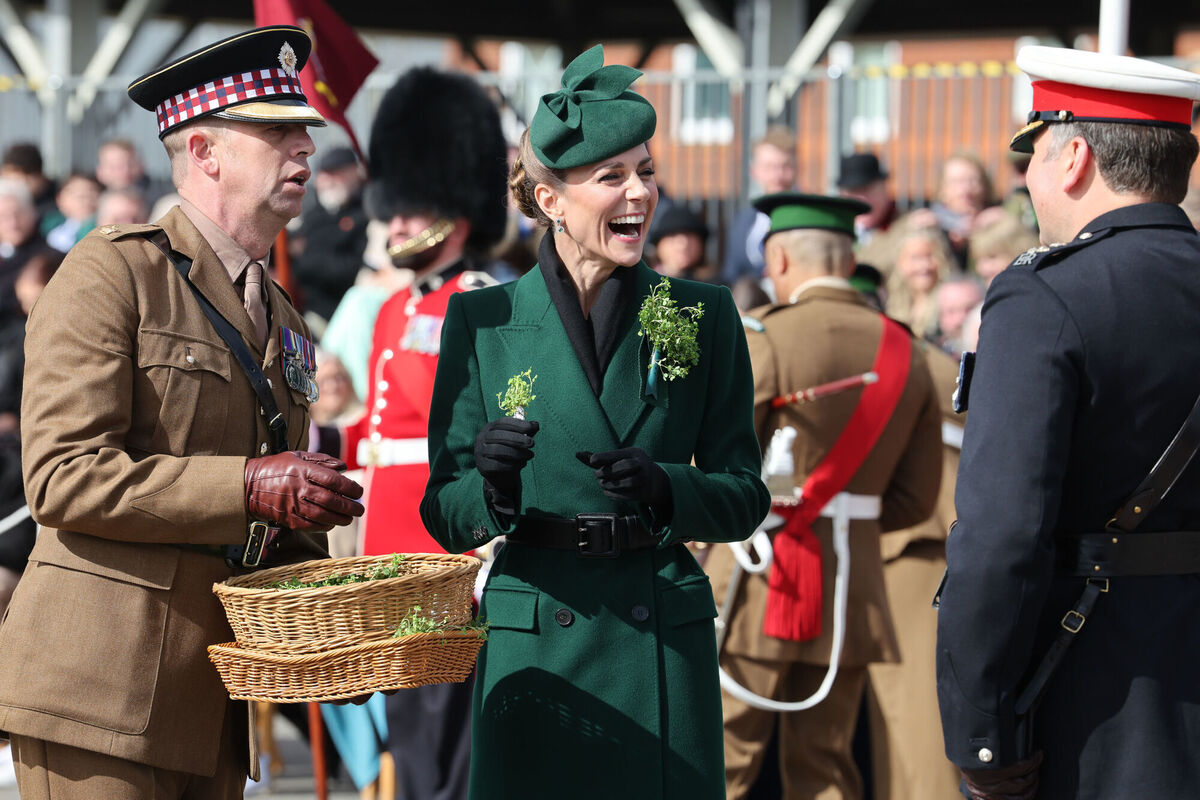 Princess Kate, in her role as Colonel of the Regiment, handing out shamrock during a visit to the 1st Battalion Irish Guards for their St Patrick's Day Parade at Mons Barracks in Aldershot, Hampshire. Picture: Richard Pohle/PA
