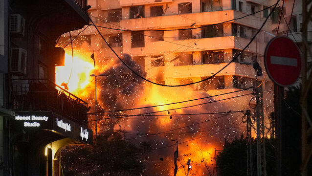<p>An explosion erupts from a building following an Israeli strike in central Beirut, Lebanon (Hussein Malla/AP)</p>