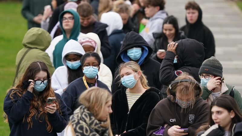 Students queuing for antibiotics outside a building at the University of Kent in Canterbury. 