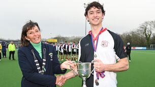 <p>Nicky Stokes, president Munster branch presents the trophy to Harlequins' captain Julian Dale after defeating Catholic Institute in the Mens Munster senior cup final at Garryduff. Picture; Eddie O'Hare</p>