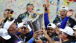 <p>Salvador Perez #13 and manager Omar López #22 of Team Venezuela lift the championship trophy after defeating Team United States 3-2 at loanDepot park on March 17, 2026 in Miami, Florida. (Photo by Al Bello/Getty Images)</p>